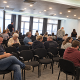 Attendees Settling Into a Seminar